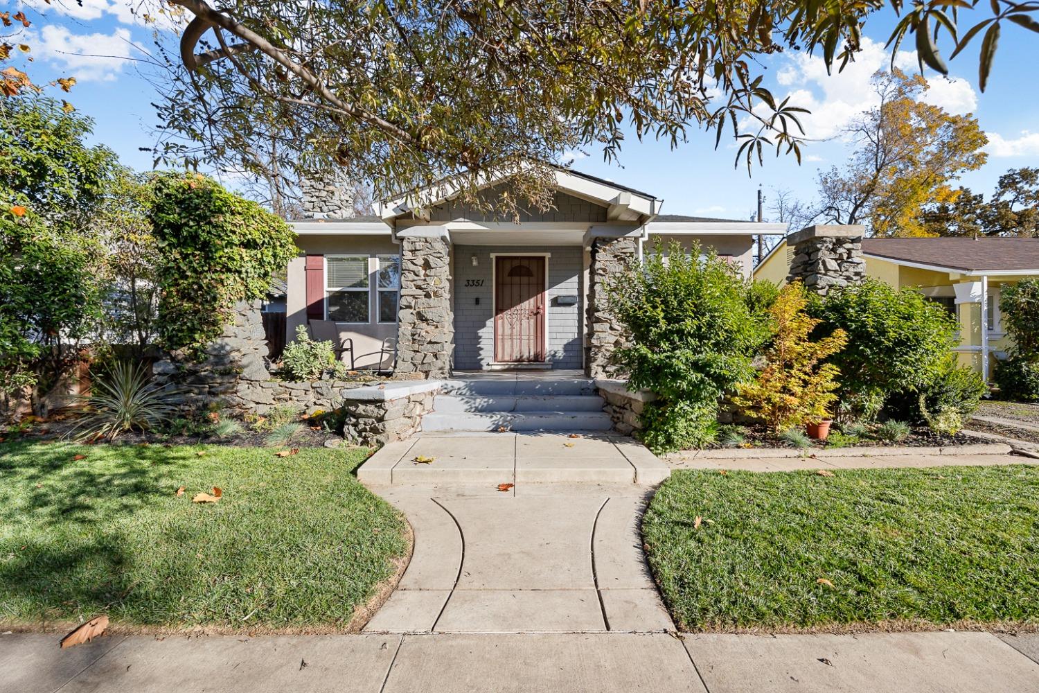 front view of a house with a garden