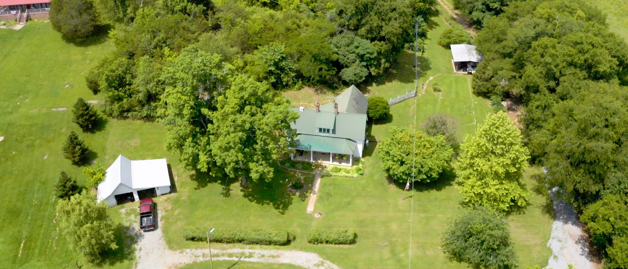 an aerial view of residential house with an outdoor space