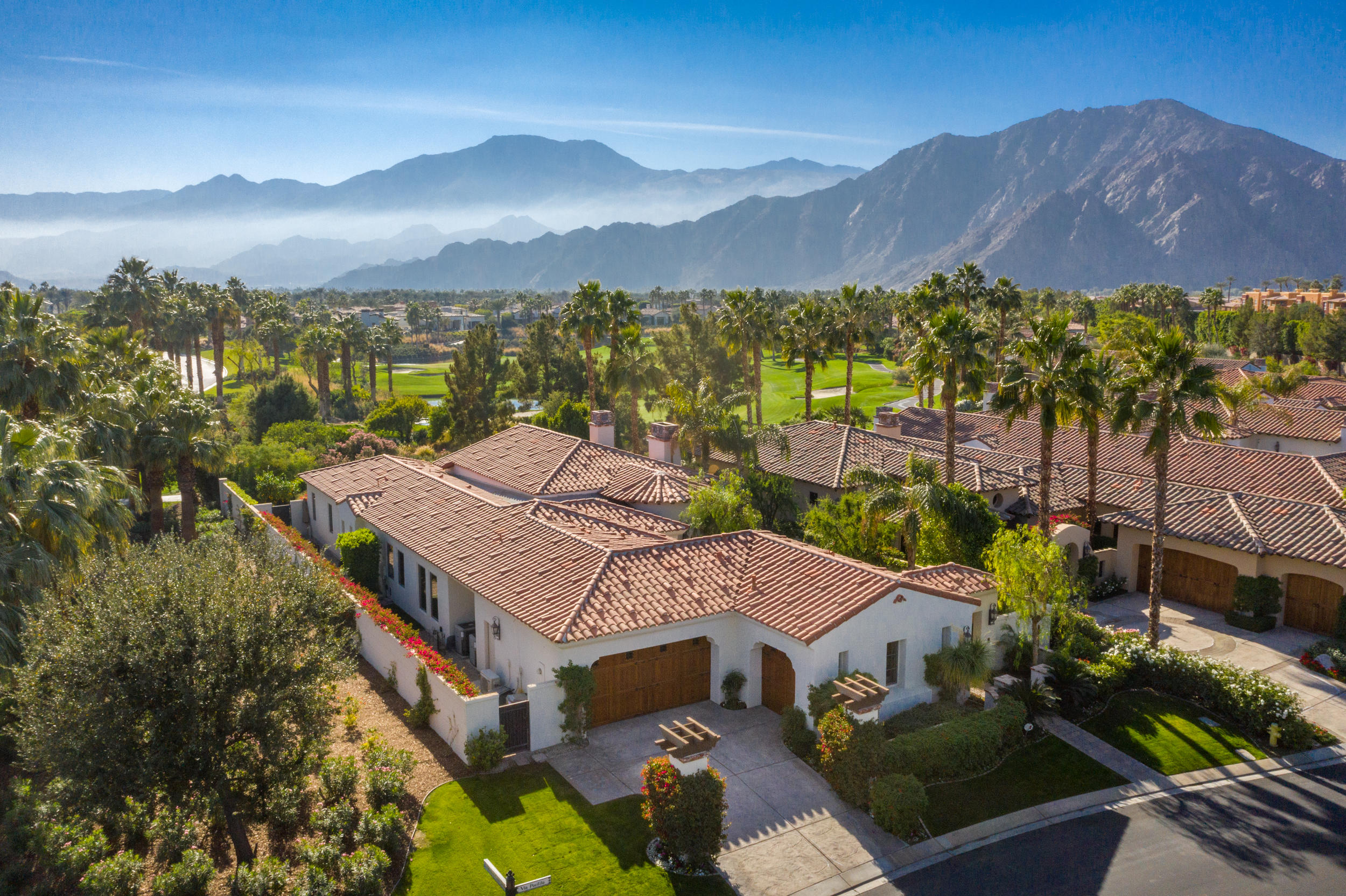 a aerial view of a house with a yard