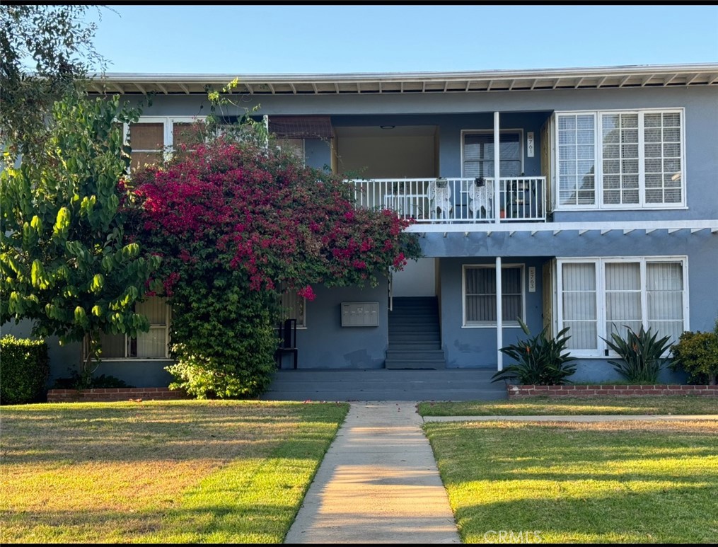 a front view of house and yard with swimming pool