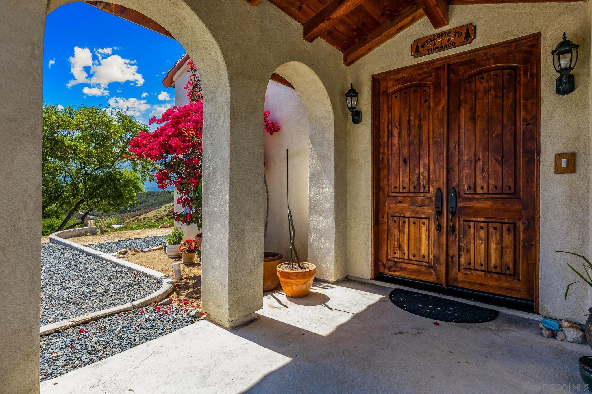 a view of front door with outdoor seating