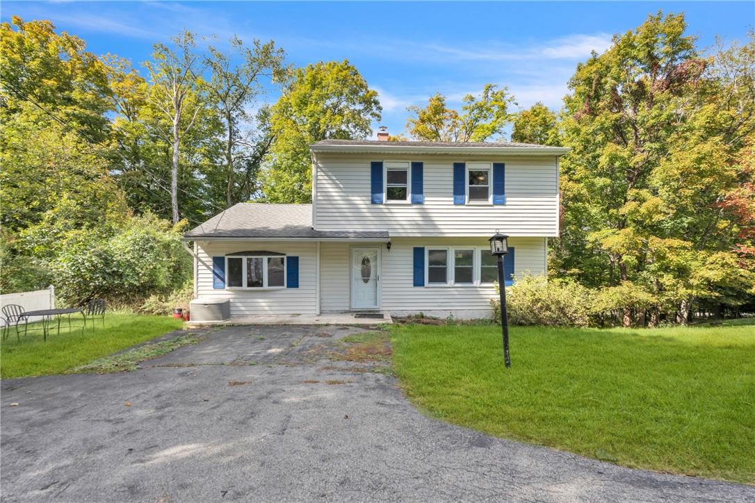 View of front property with a front yard