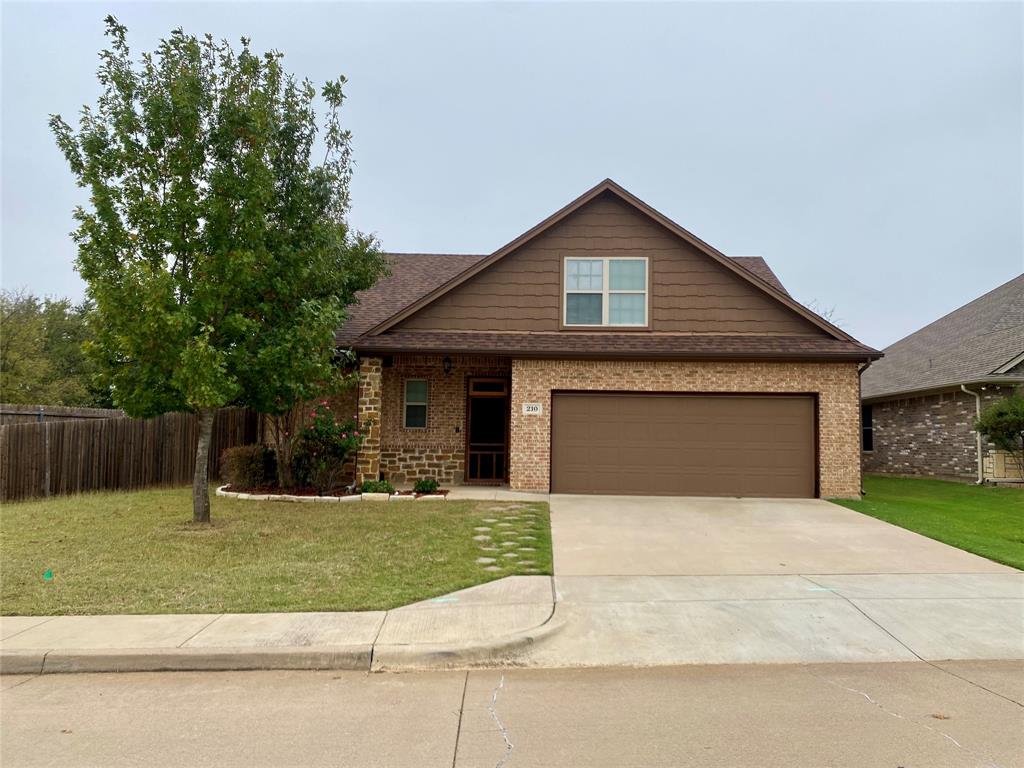 a front view of a house with yard