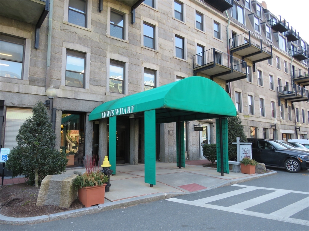 a view of a building with a bench in front of building