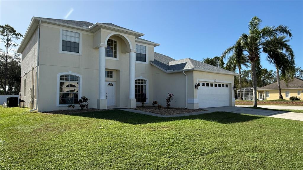 a view of a back yard of the house