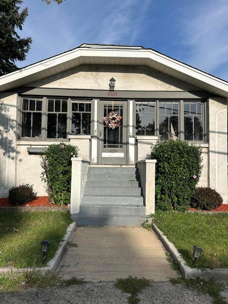 front view of a house with a yard