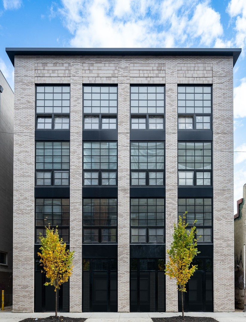 a front view of a house with glass windows