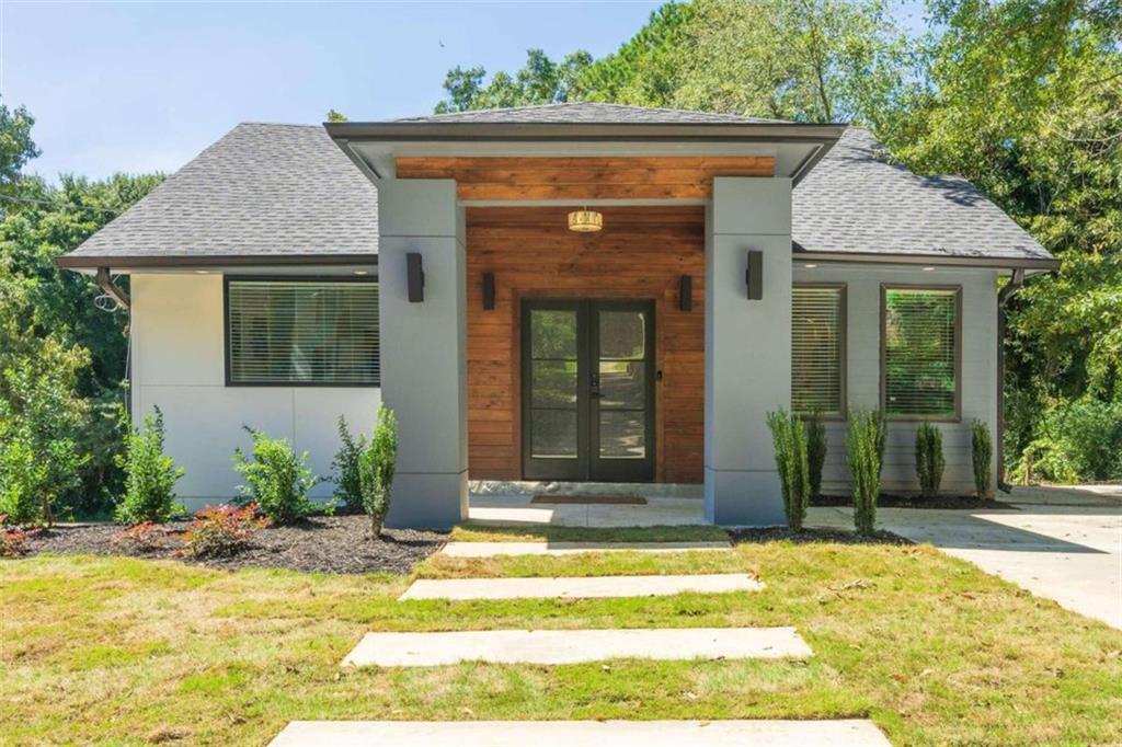 a view of a house with small garden