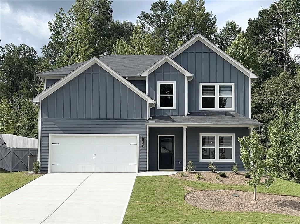 a front view of a house with yard