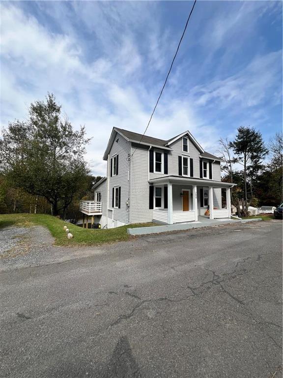 a view of a house with a street