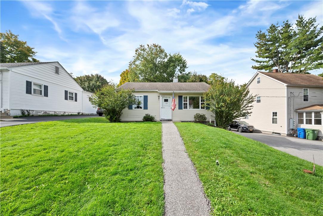 a front view of a house with a yard