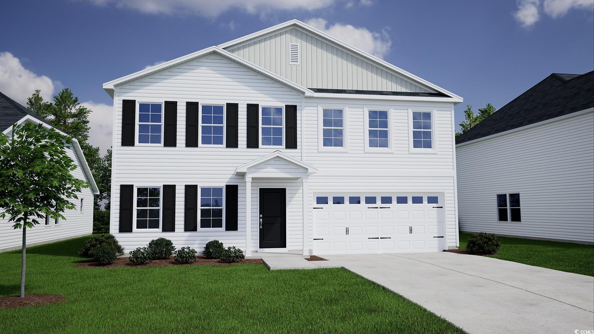 View of front of house featuring a garage and a fr