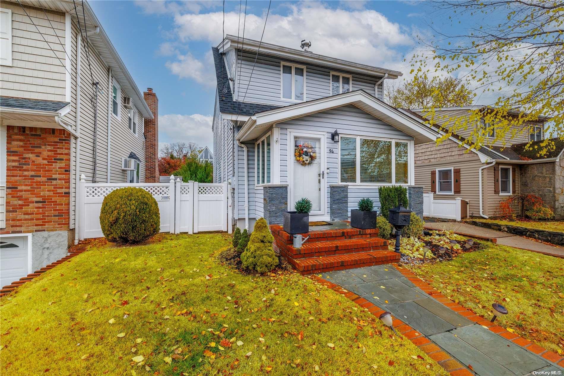 a front view of house with yard outdoor seating and barbeque oven