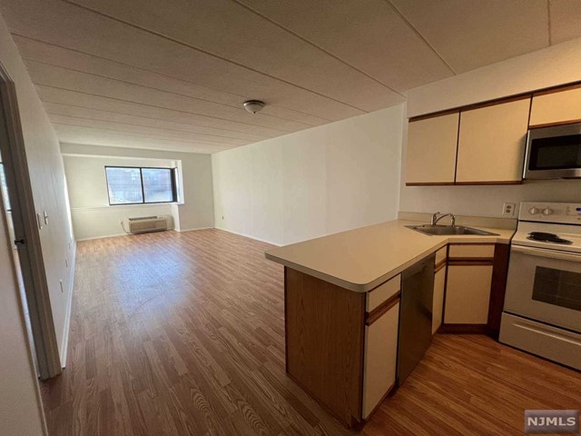 a kitchen with a stove and a microwave