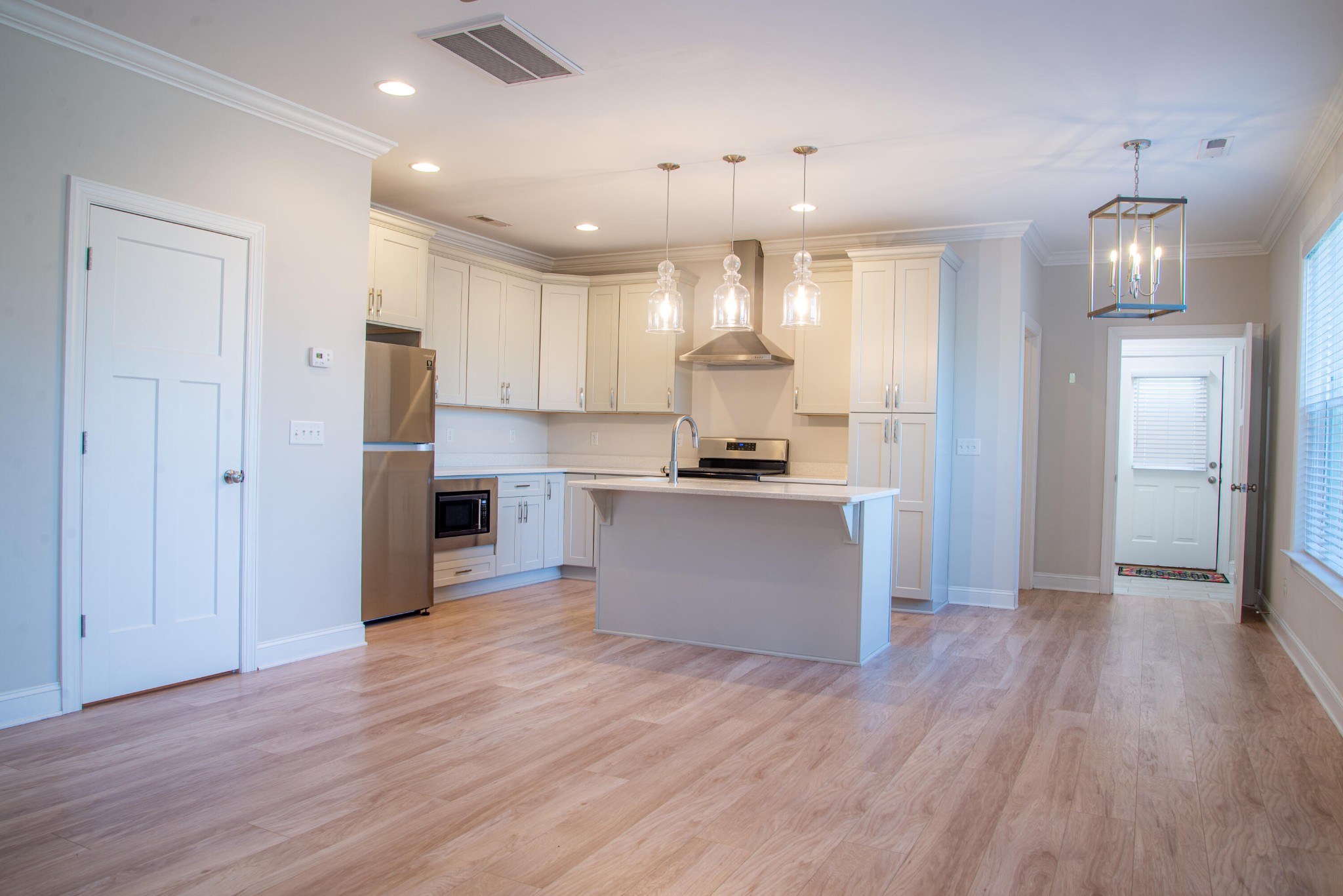 a view of kitchen with wooden floor