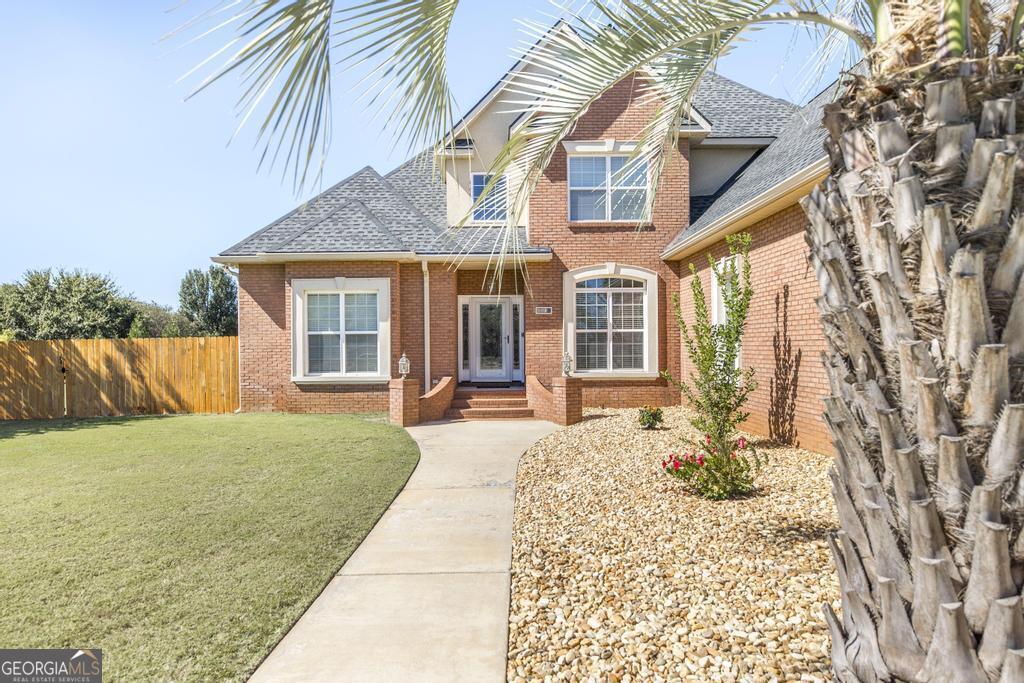 a front view of a house with a porch