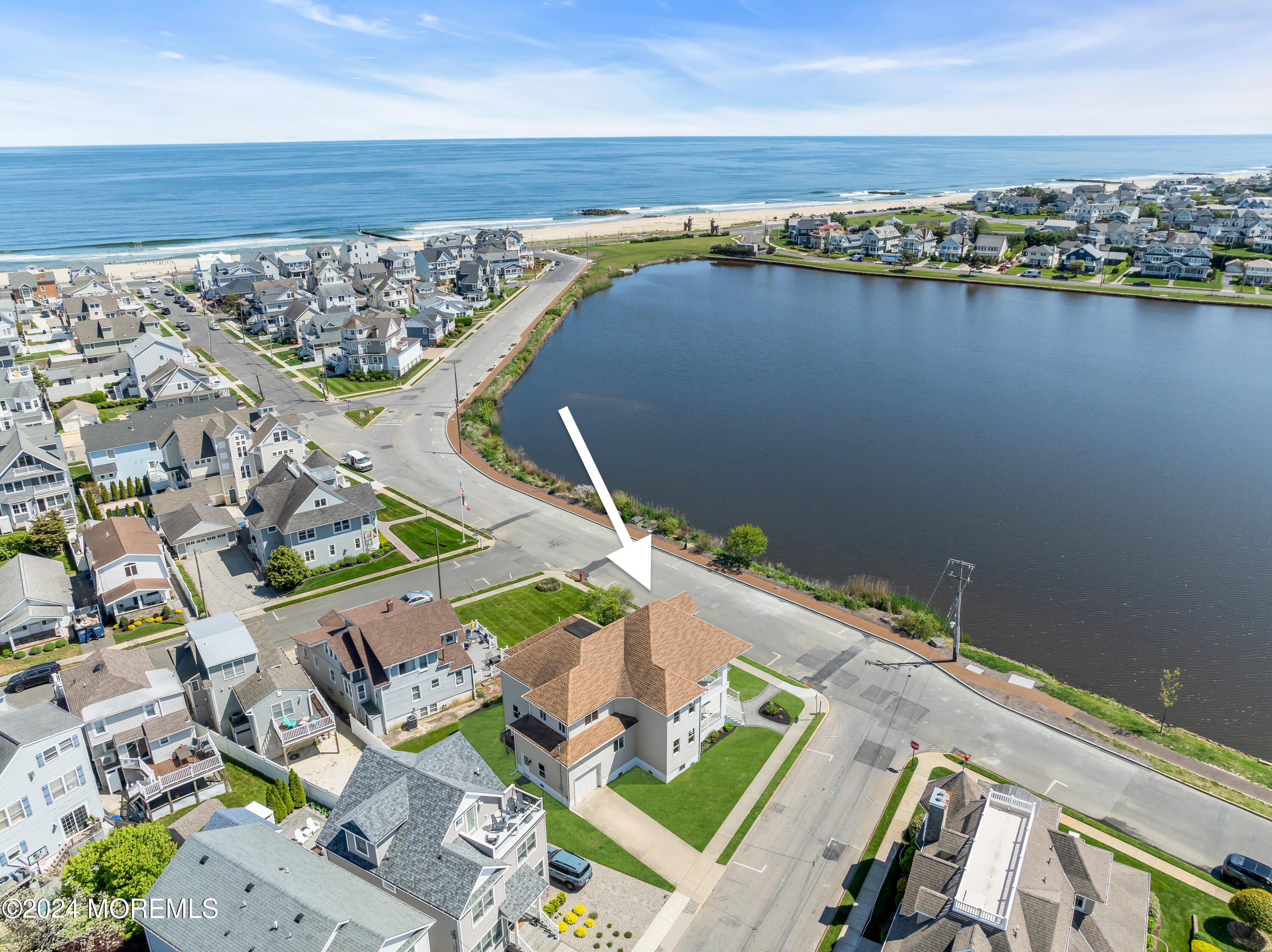 an aerial view of a house with a lake view