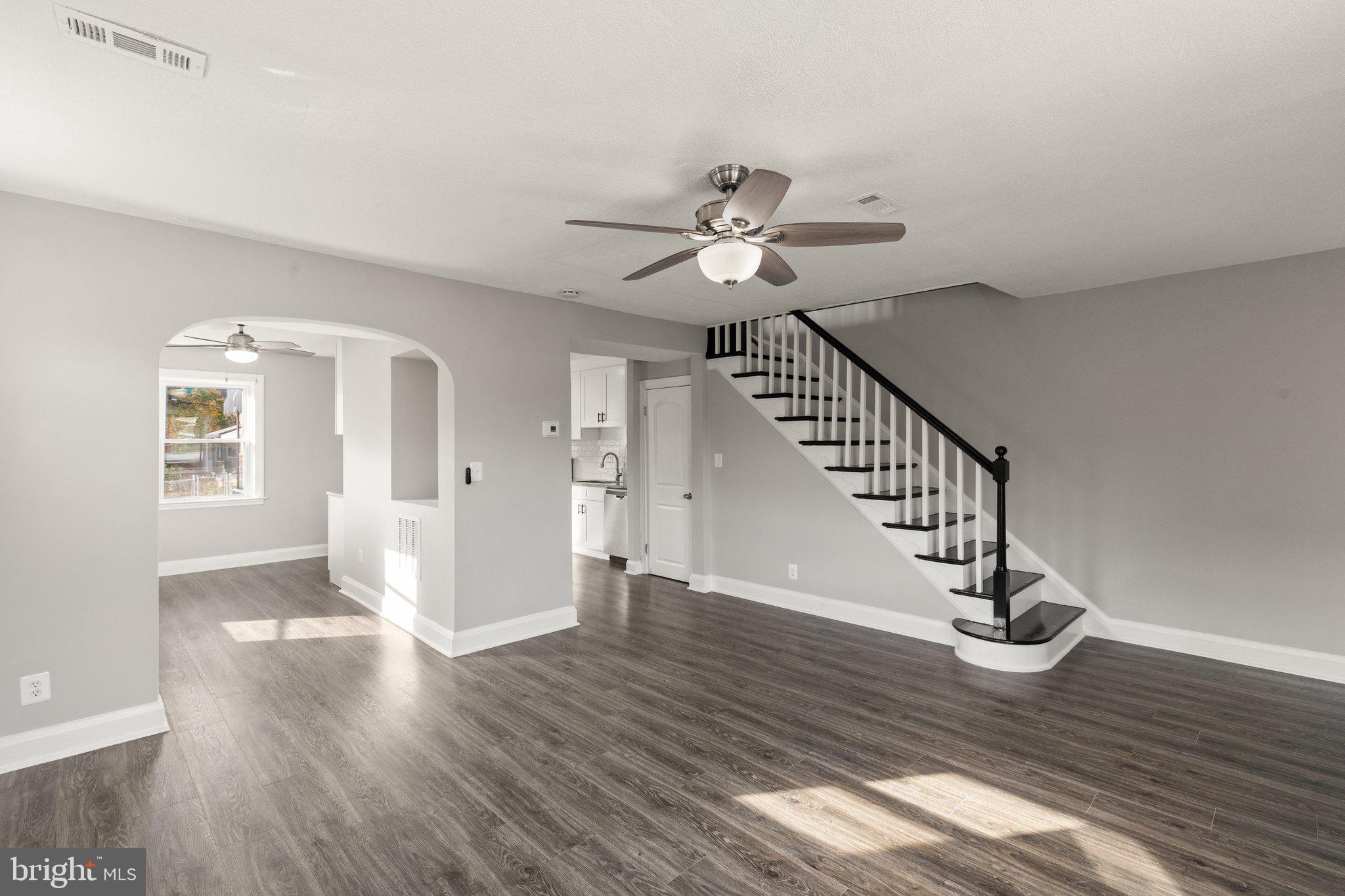 a view of an entryway with wooden floor