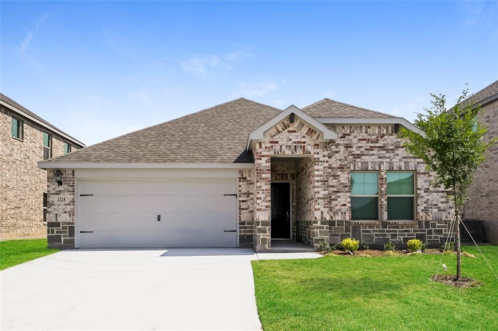 front view of a house with a yard