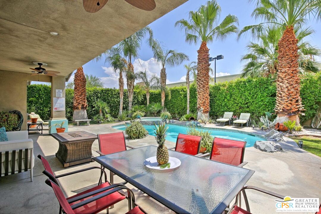 a view of a tables and chairs in patio