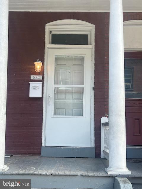 a view of a fireplace and window