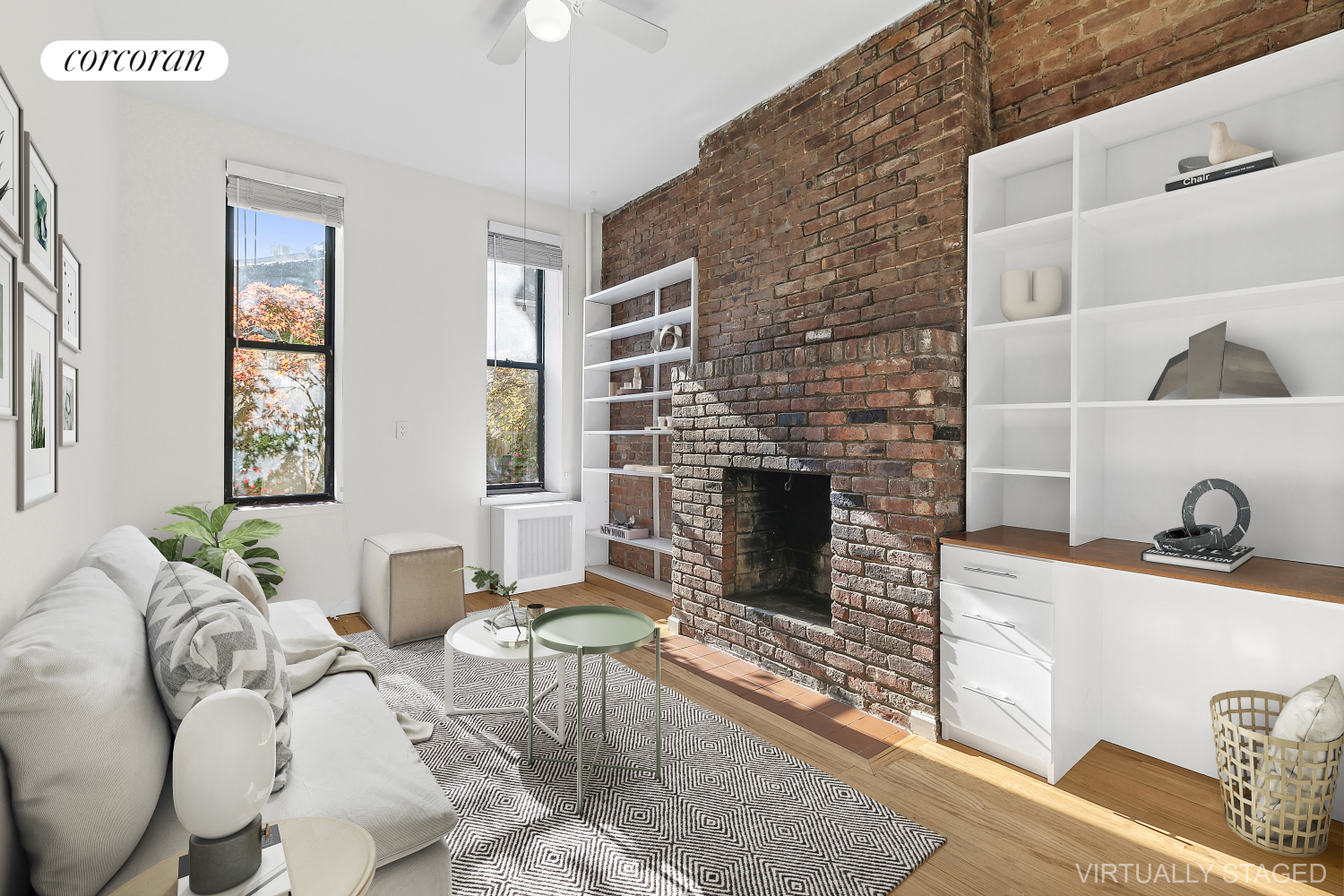 a living room with furniture a flat screen tv and a fireplace