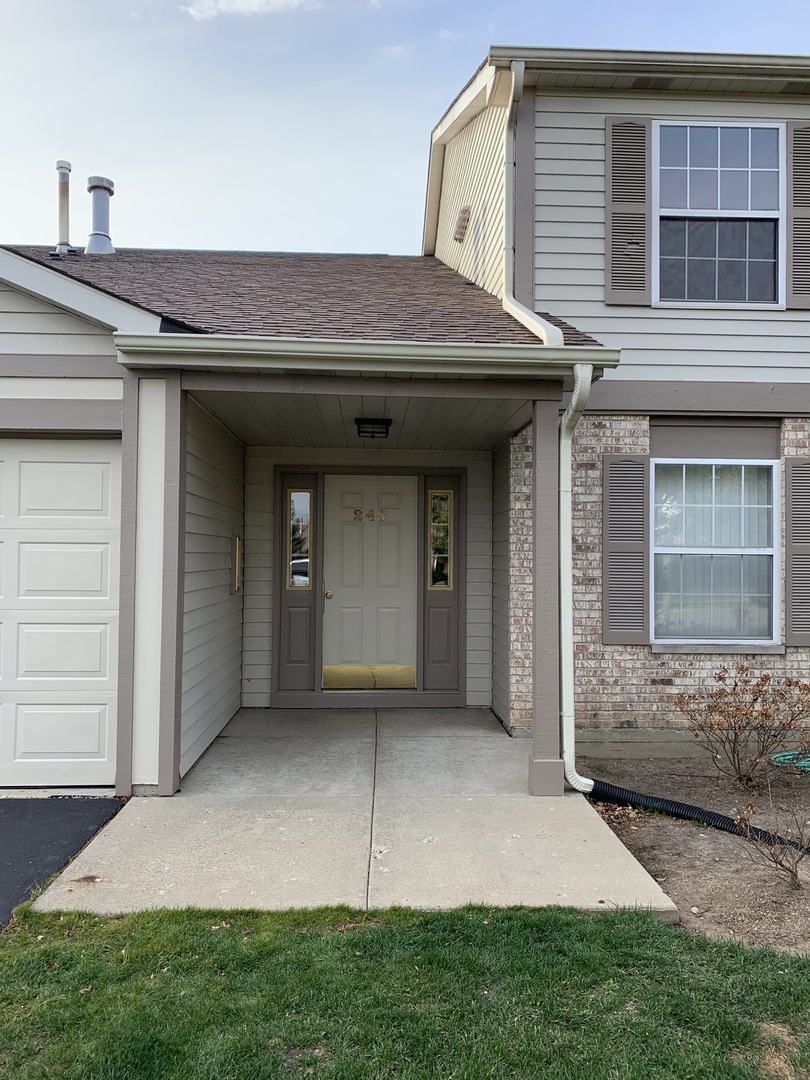 a view of outdoor space yard and front view of a house