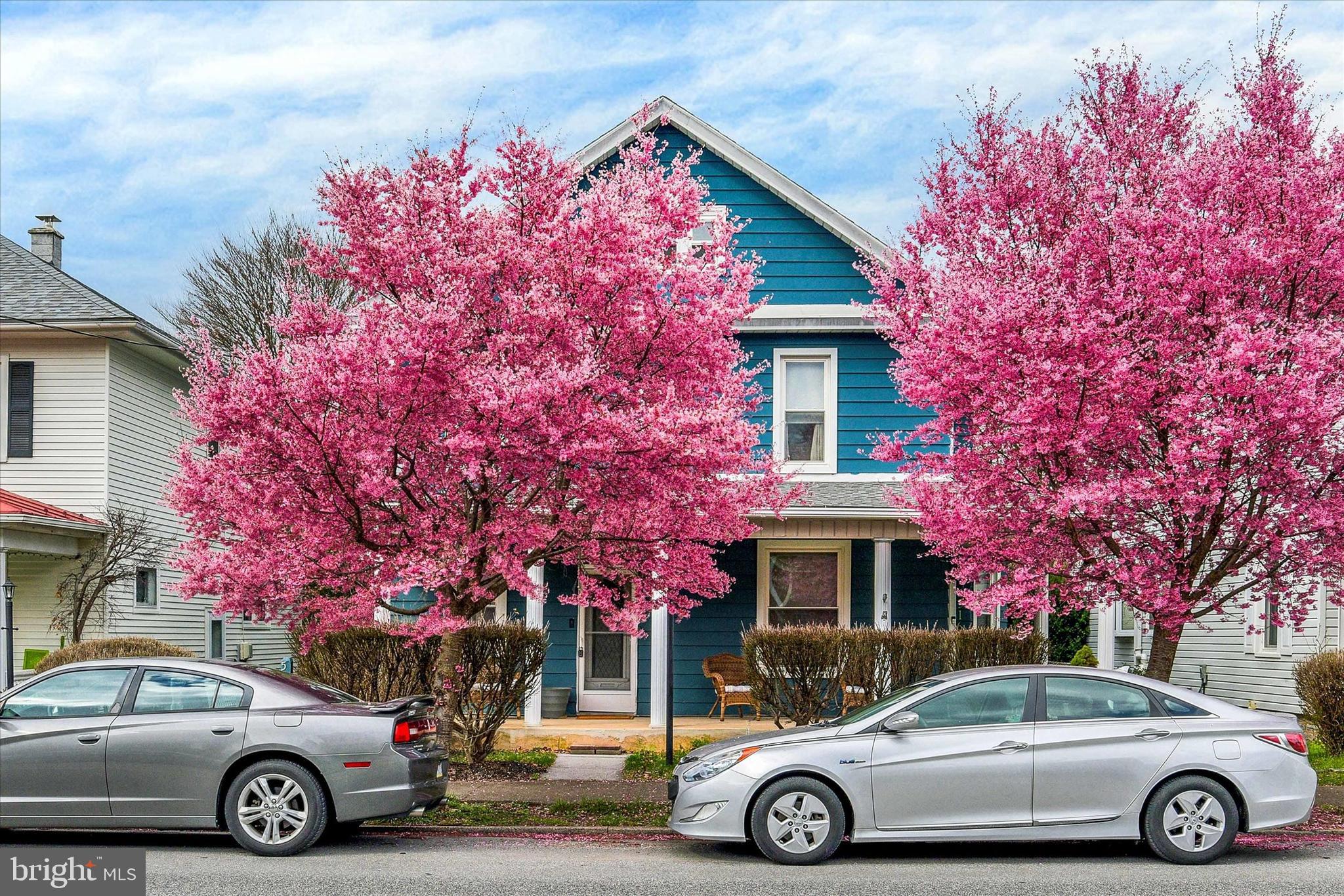 a front view of a house with parking space