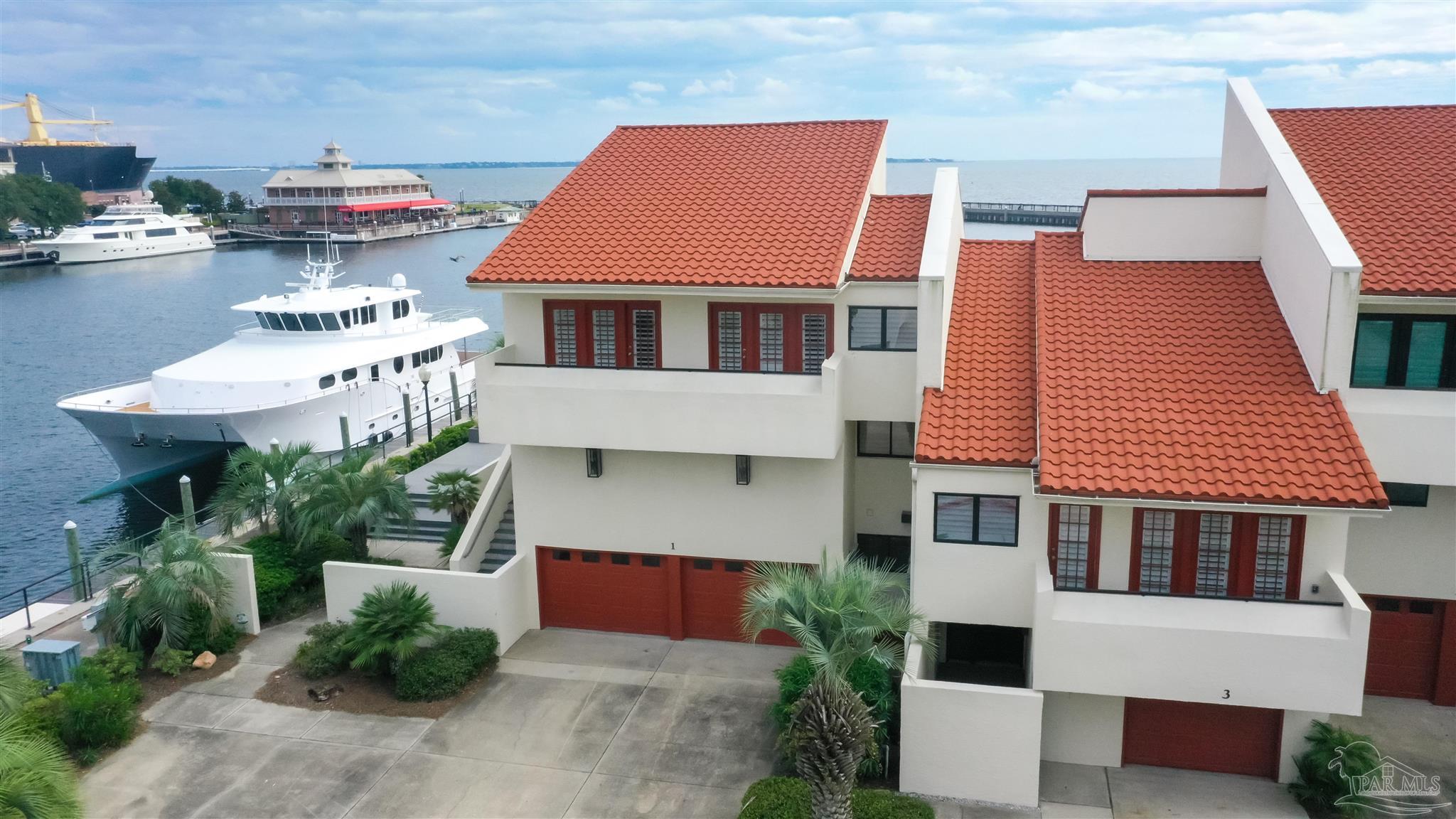 a aerial view of a house with sitting area and swimming pool