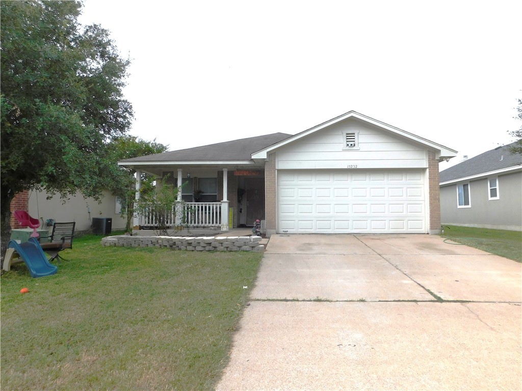 a front view of a house with a garden and porch