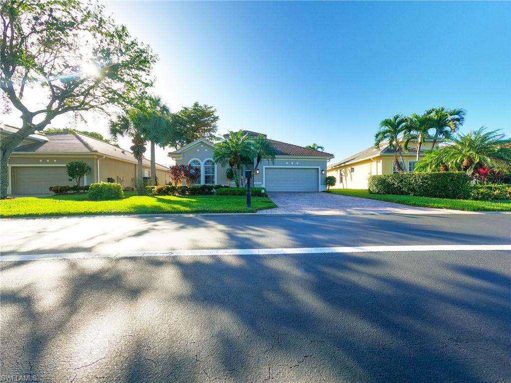 Ranch-style home with a garage and a front yard