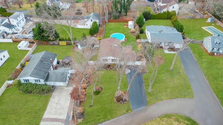 an aerial view of a house with a garden