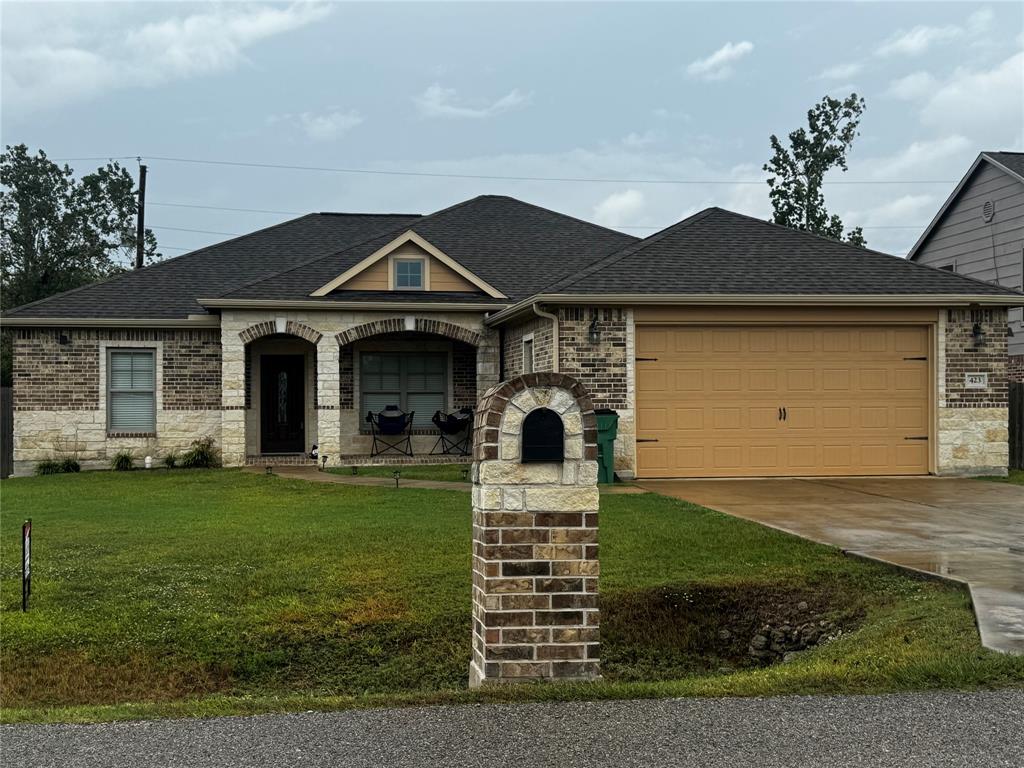 a front view of a house with garden