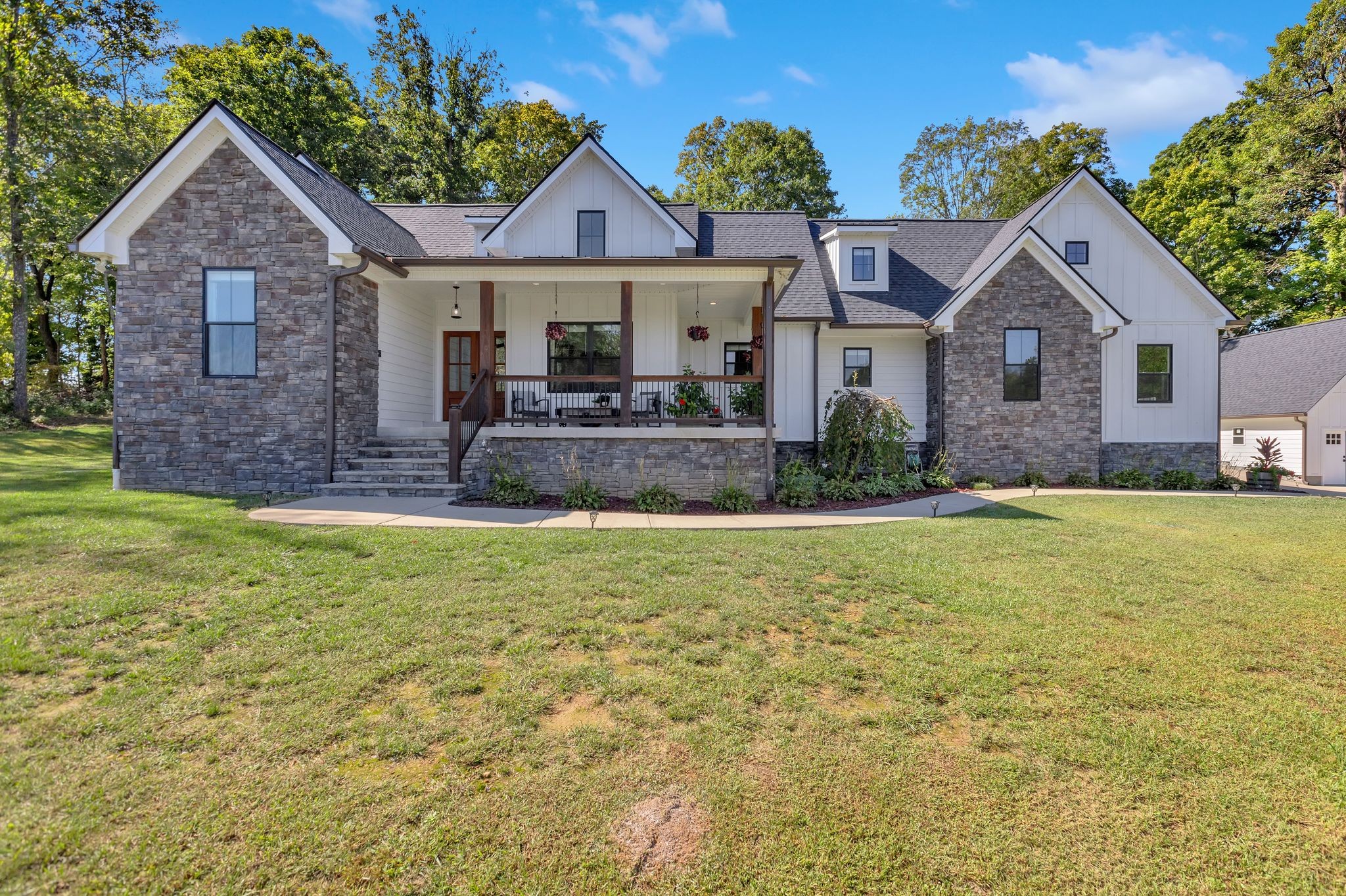 a front view of a house with a yard