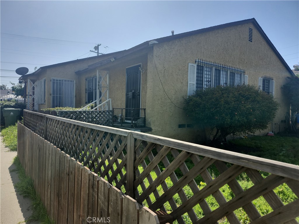 a balcony view with a backyard space