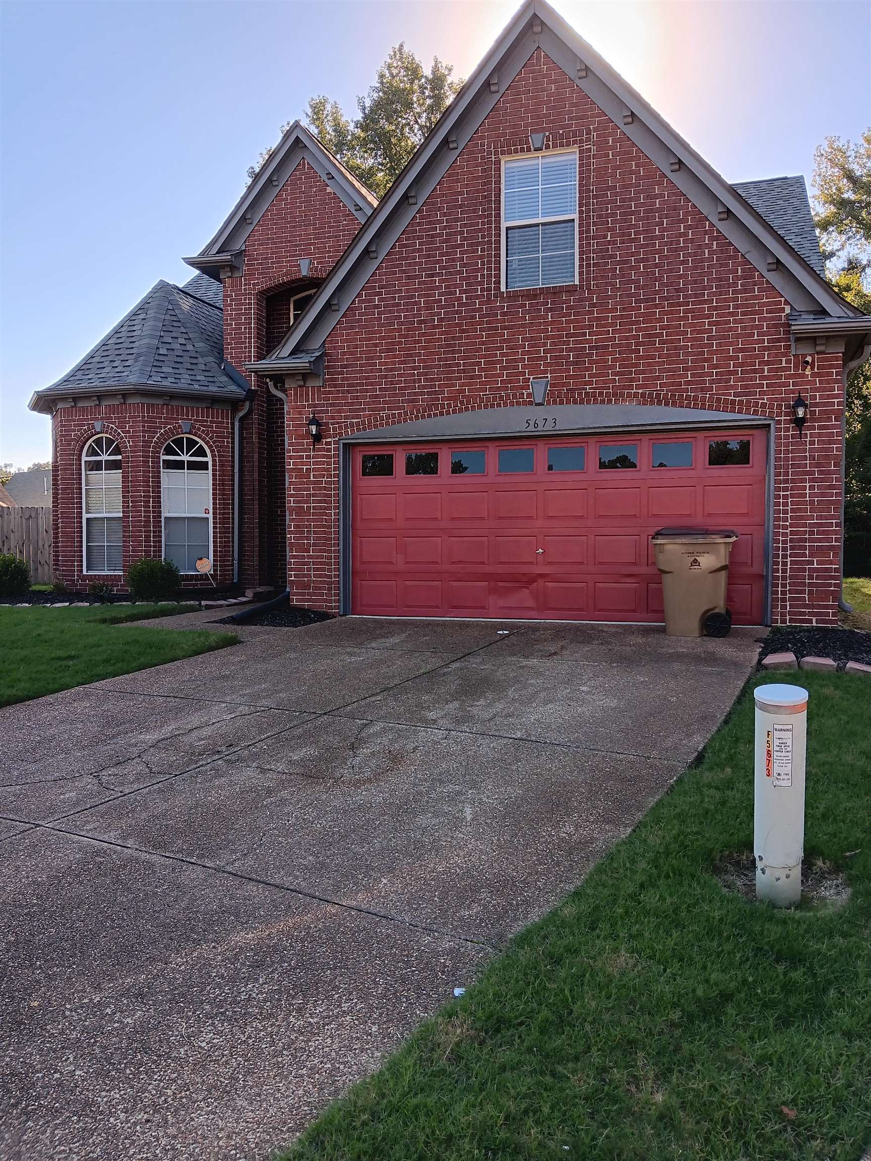 a front view of house with yard and trees