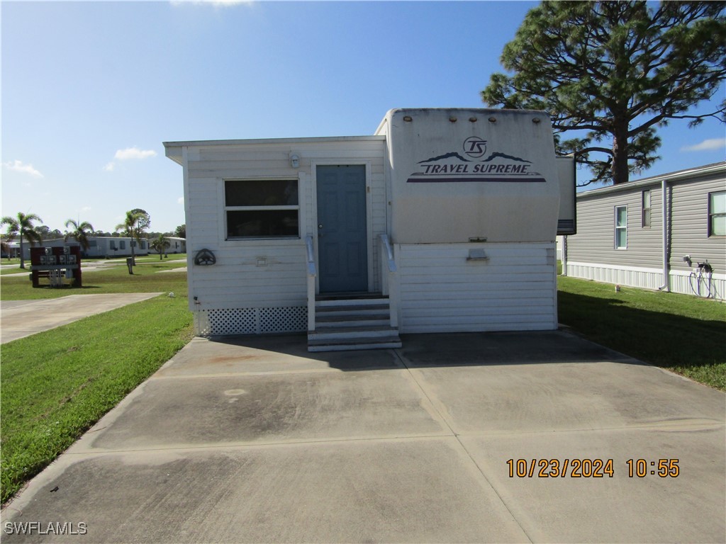 a view of a parking space in front of a house