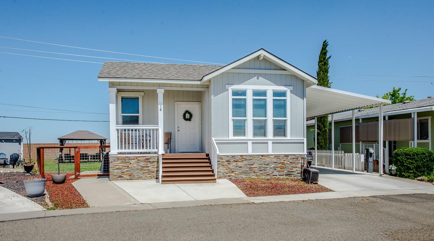 a front view of a house with garage