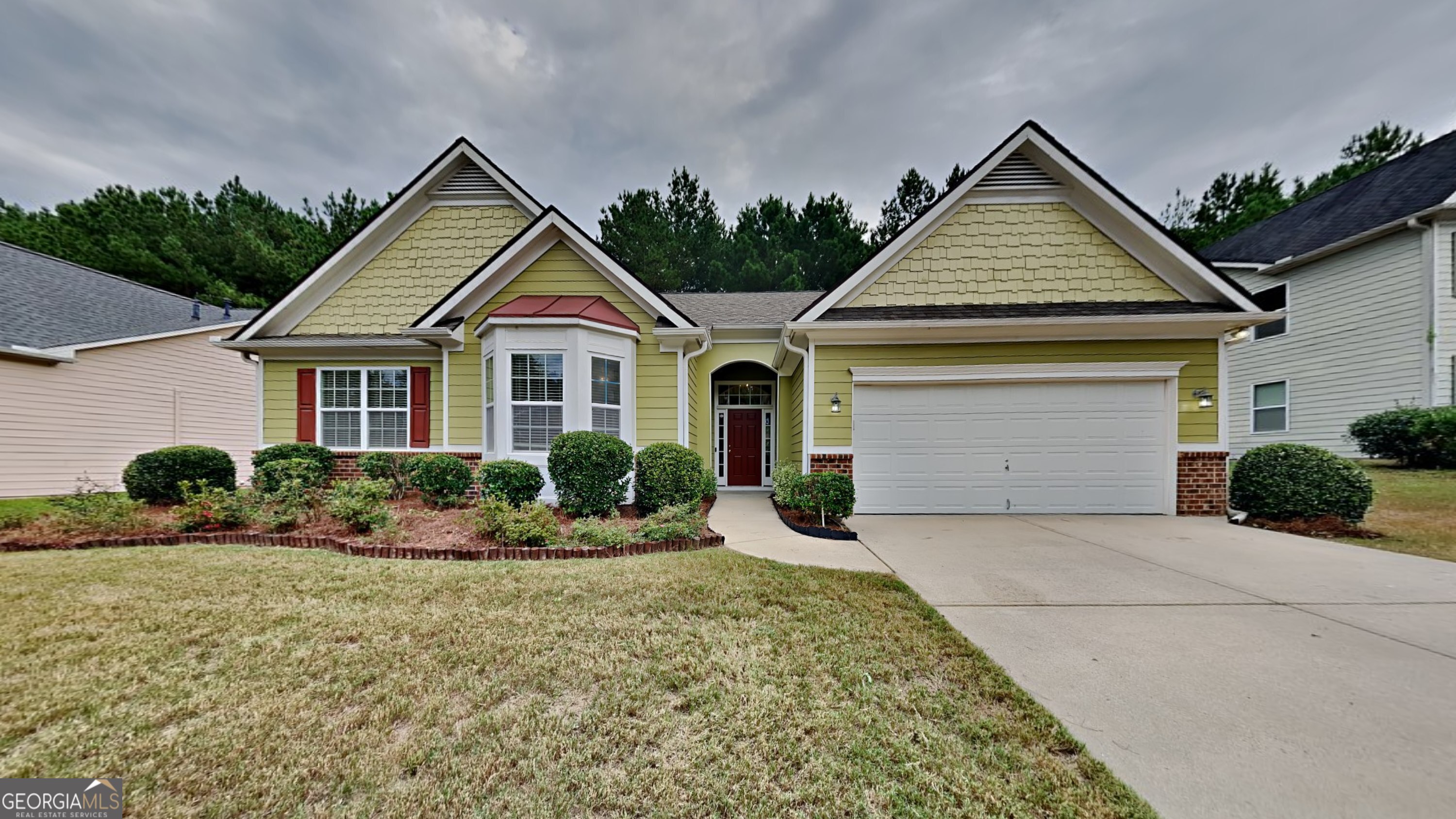 a front view of a house with a yard