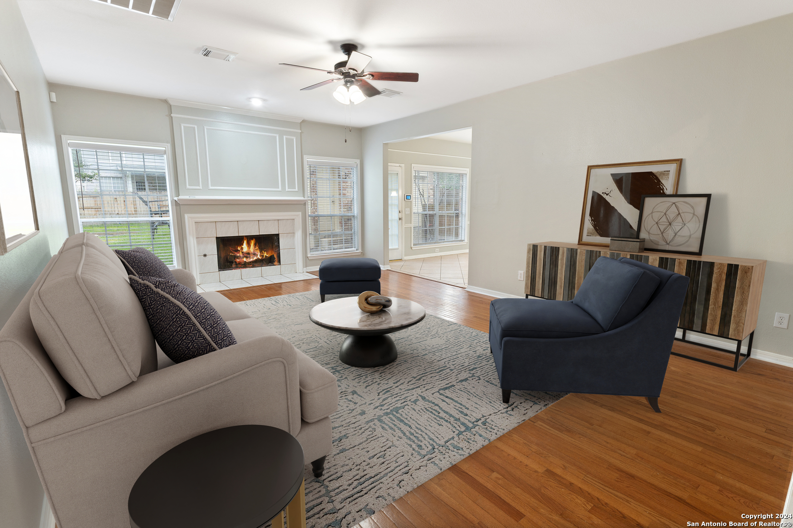 a living room with furniture and a fireplace