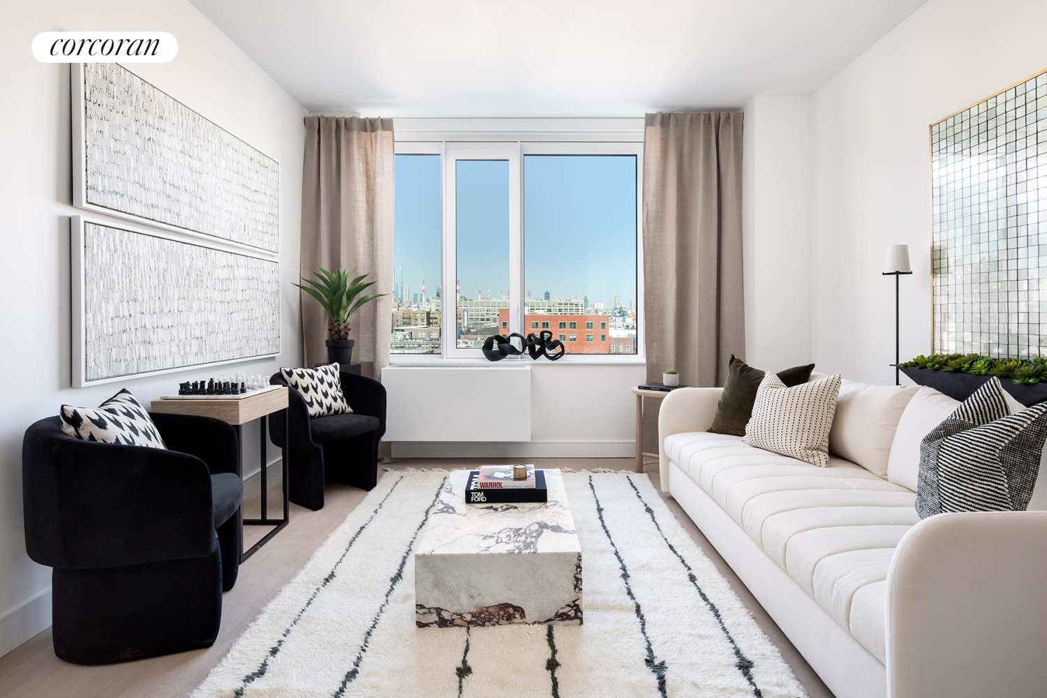 a living room with furniture and large windows