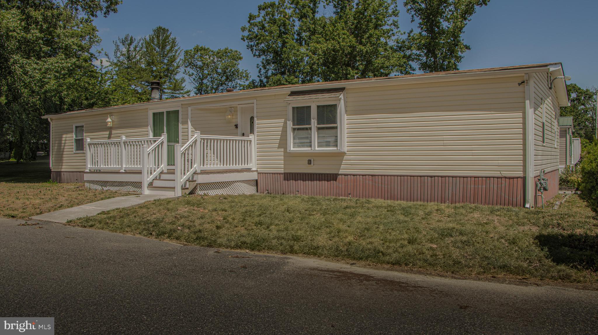 a view of a house with a yard and garage