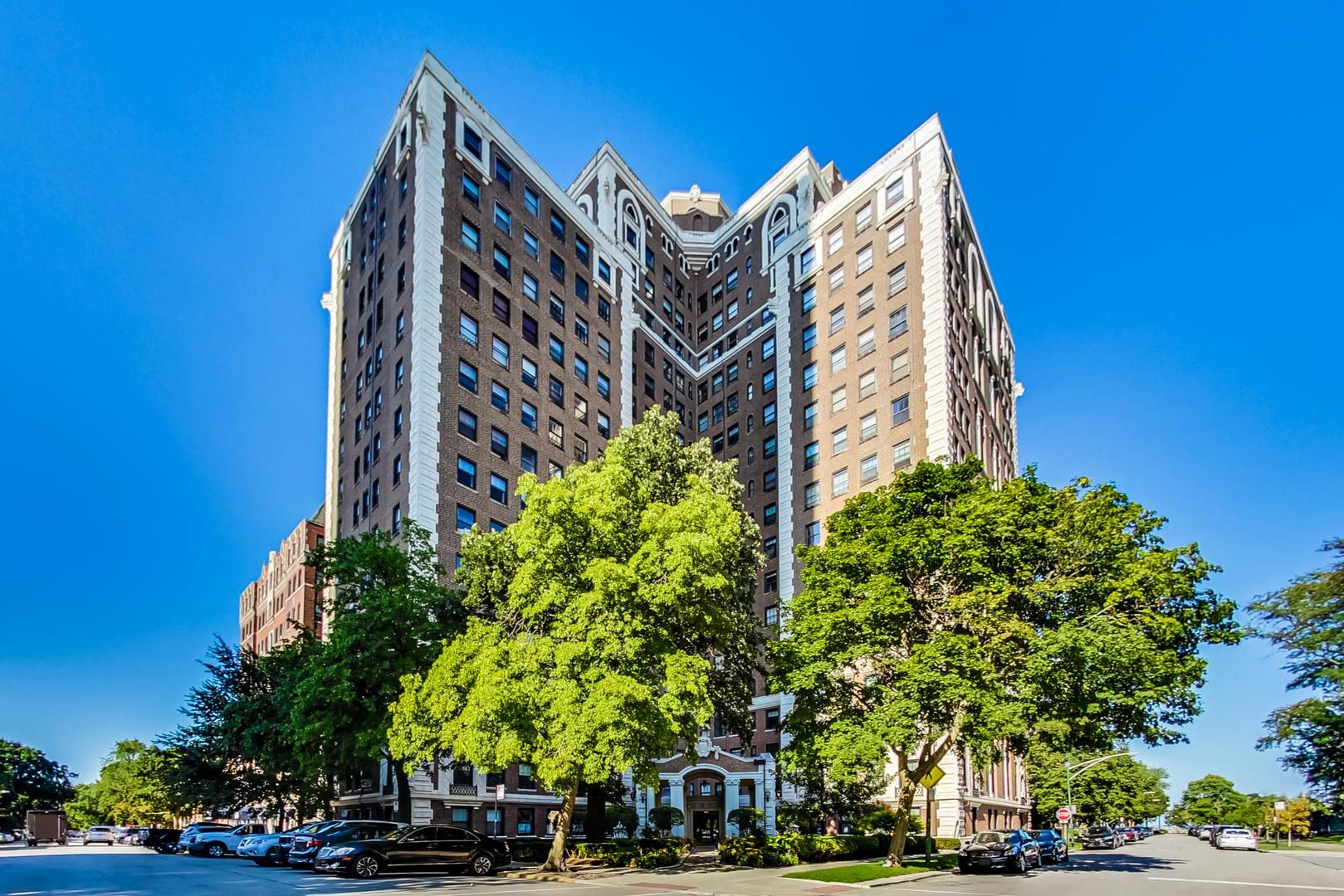 a view of tall building next to a road