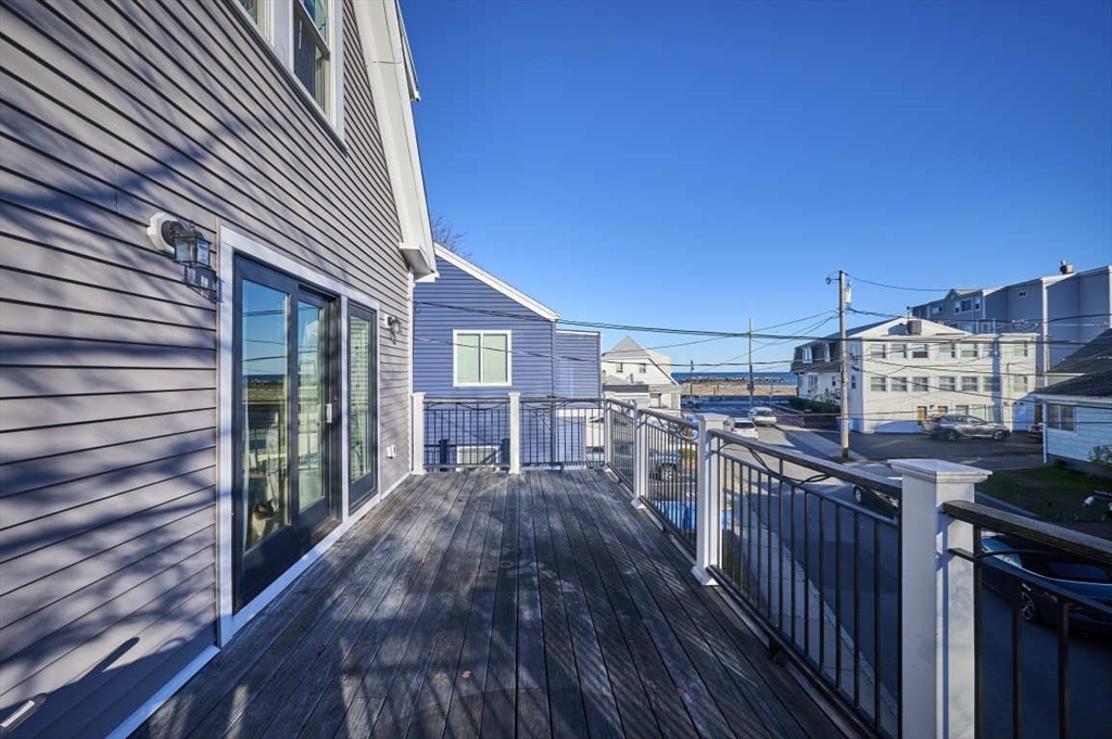 a view of a patio with wooden floor