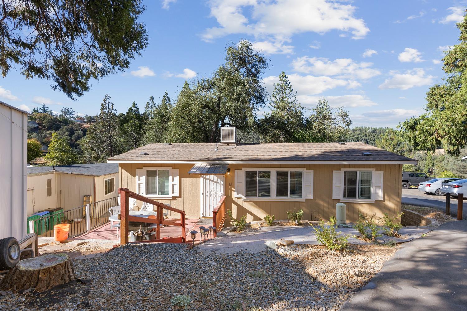 an aerial view of a house with backyard space and balcony