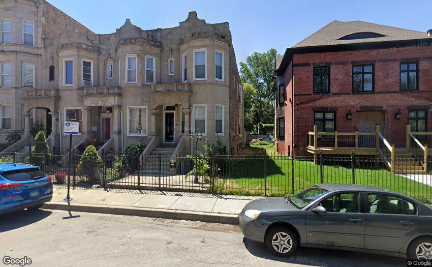 a view of a car parked in front of a house