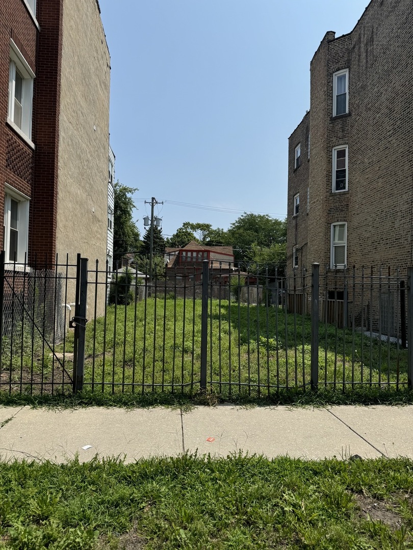 a street view of a house with a garden