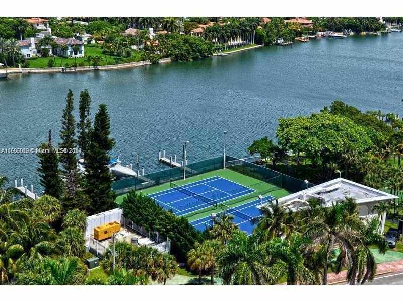 an aerial view of a house with a lake view