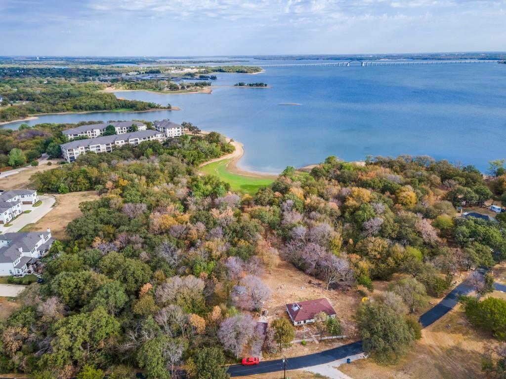 a view of a lake with houses in the back