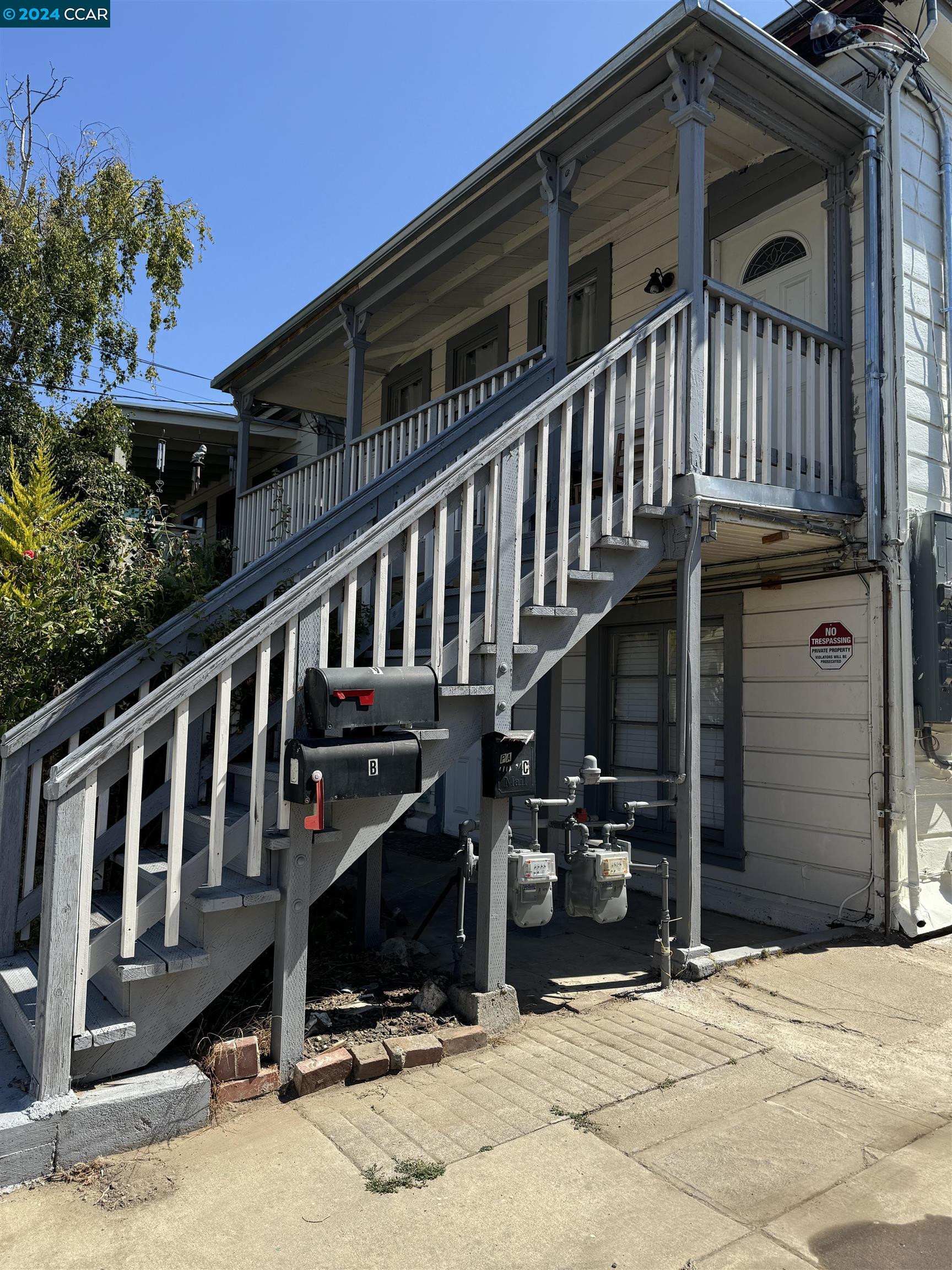 a view of a house with wooden stairs